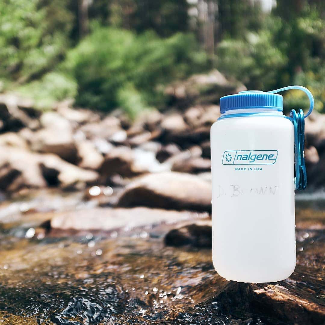 32oz Wide Mouth Ultralite Bottle atop a rock in a creek