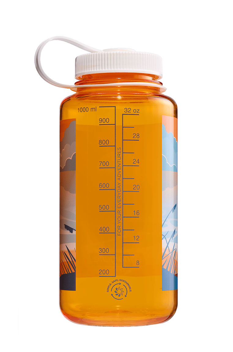 Transparent orange water bottle with measurement markings and outdoor-themed graphics on the side.